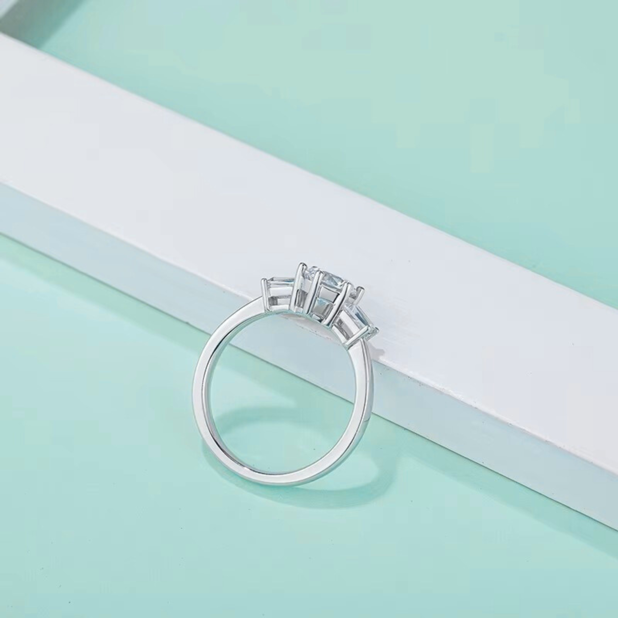 Round Three-Stone Ring with Baguette Accents