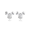 Silver bow-shaped earrings with clear gemstones on a white background